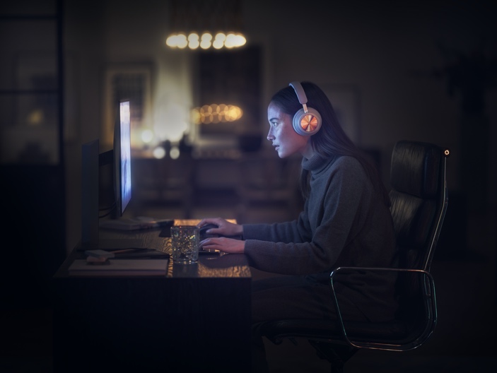 A person wearing a mask and sitting at a desk

Description automatically generated with low confidence